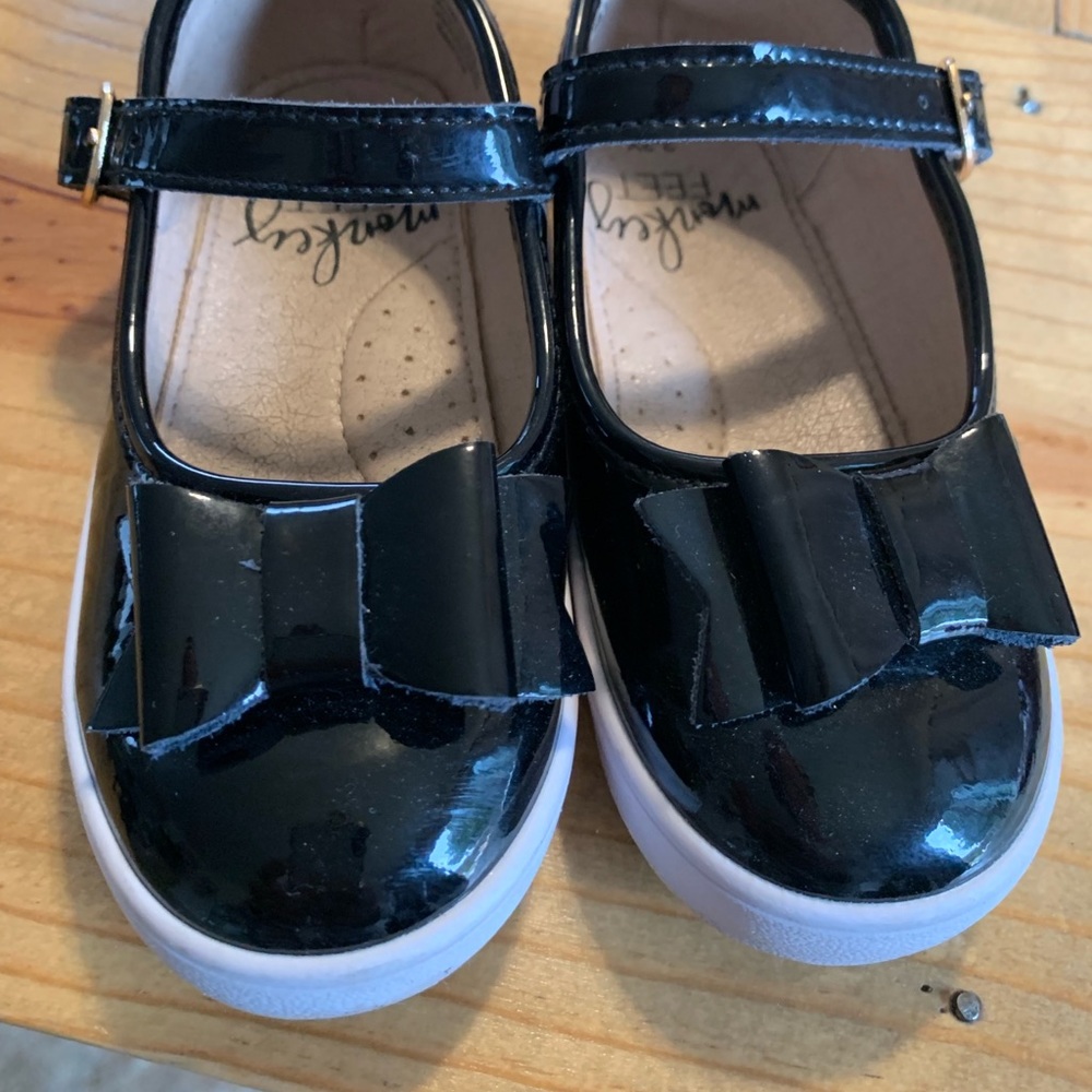 3/4 monkey feet Mary Janes patent leather red bottoms. Black. Good condition